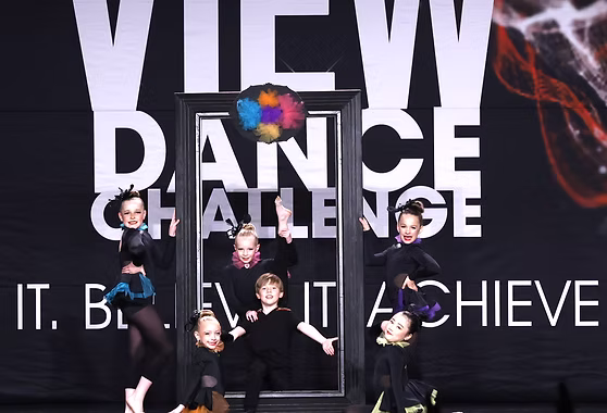 Danscott jazz dancers performing a colourful picture-frame routine on stage